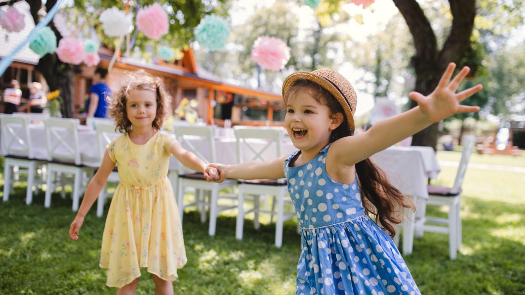 girls running around at a birthday party