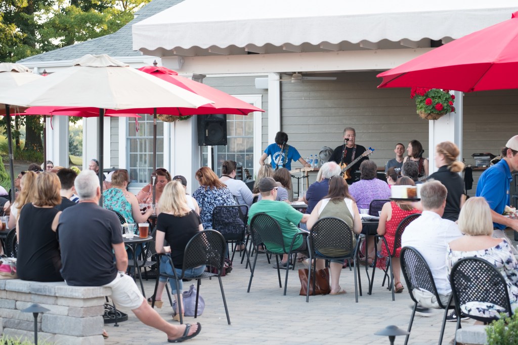 guests enjoying live music in the patio area